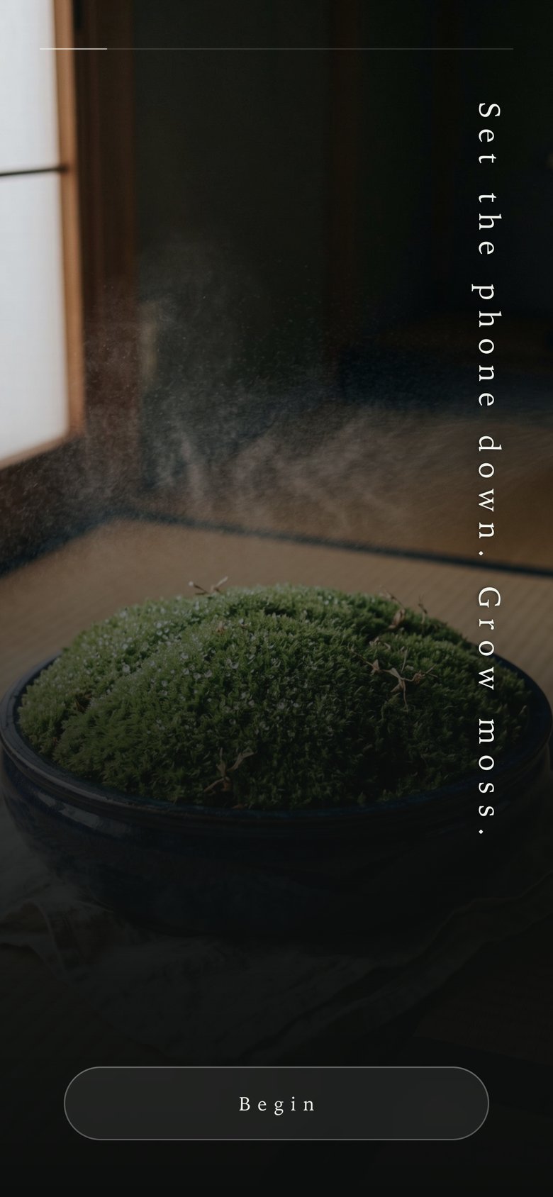 Opening screen: a bowl of moss on tatami and the words Set the phone down. Grow moss.